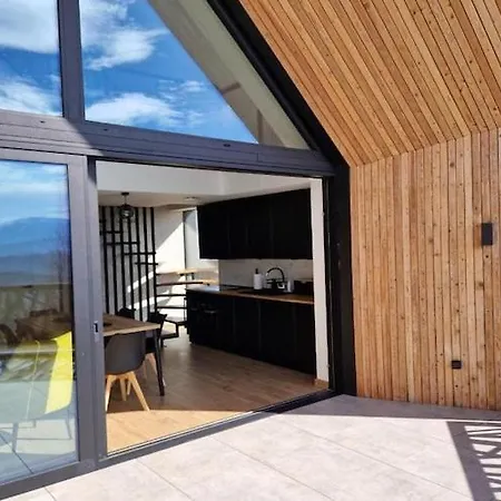House With A Garden And A View Of The Mountains