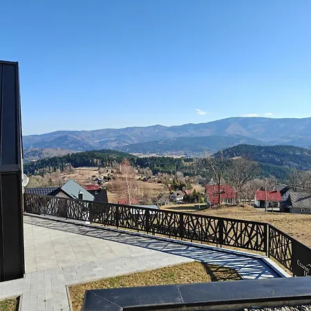 House With A Garden And A View Of The Mountains